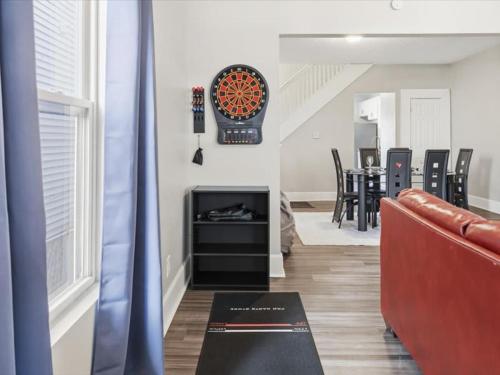 a living room with a couch and a fireplace at Prime Downtown Indy House Close to DT Indy in Indianapolis
