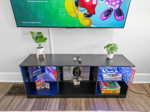 a black table with toys on top of it at Prime Downtown Indy House Close to DT Indy in Indianapolis