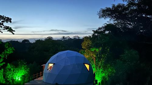 a blue dome tent in the middle of a forest at Chalés Pura Vida in Itacaré