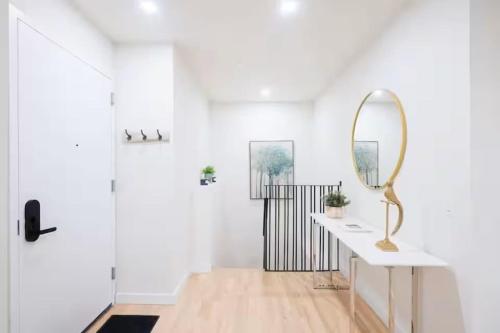 a bathroom with a mirror on a counter and a sink at Luxury 2BR Duplex 5min to Central Park in New York
