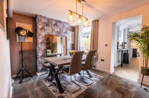 a dining room with a table and chairs at Telford Family 3 Bedroom Retreat in Oakengates