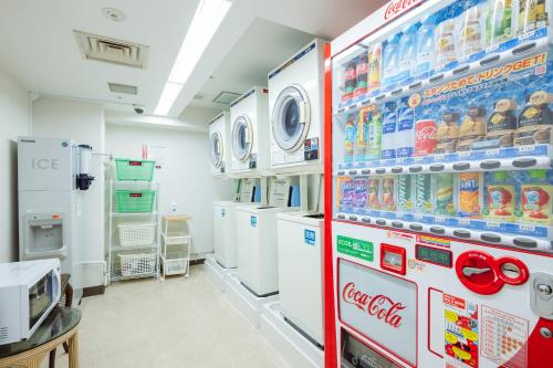 a laboratory with a refrigerators and machines at Nest Hotel Matsuyama in Matsuyama