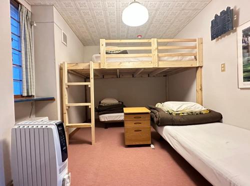 En eller flere senge i et værelse på 蔵王ペンションKomorebi