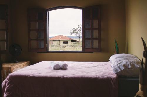 Ένα ή περισσότερα κρεβάτια σε δωμάτιο στο Casa com piscina Natural e vista panorâmica