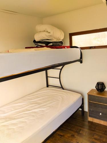 Una cama o camas en una habitación de Cabañas La Boca 2