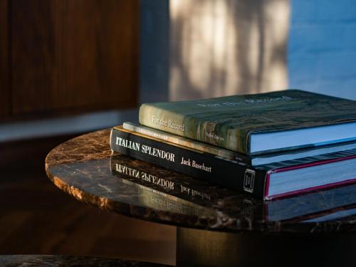 a pile of books sitting on top of a table at Claremont Oak Estate in Launceston