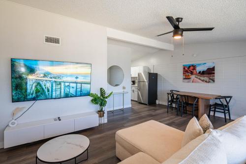 a living room with a couch and a table at Spacious 2 Bedroom, 2 Bath, Pool, Free Parking, Gym in Scottsdale