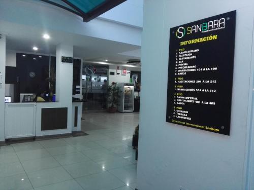 a sign hanging on a wall in a store at Gran Hotel Internacional Sanbara in Arauca