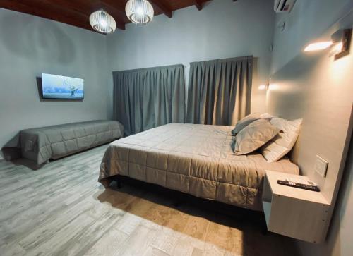 En eller flere senge i et værelse på Casa lujosa en Tanti