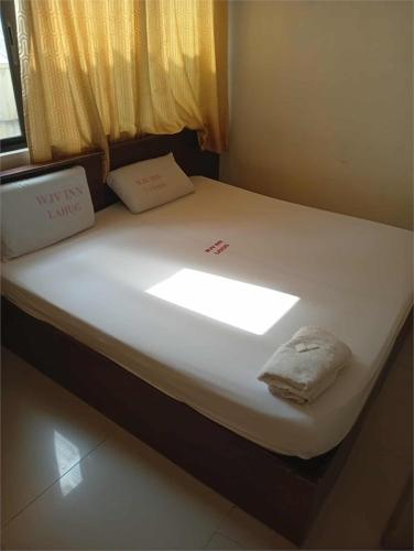 Кровать или кровати в номере WJV INN LAHUG
