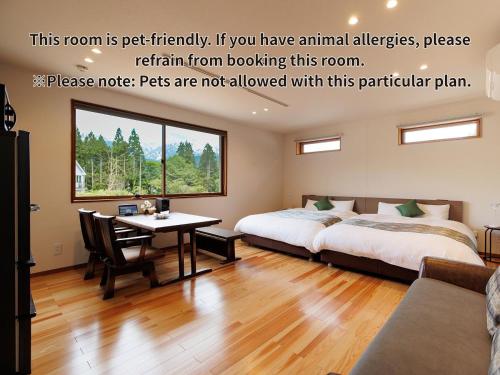 Ένα ή περισσότερα κρεβάτια σε δωμάτιο στο Hakuba Highland Hotel