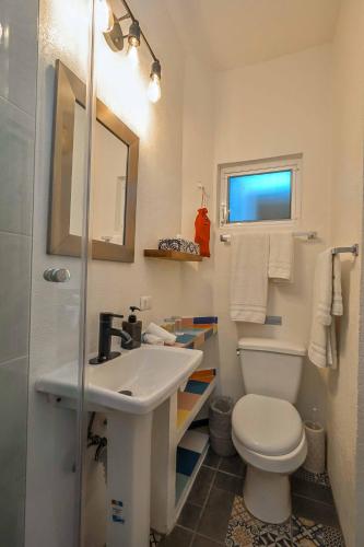 a bathroom with a sink and a toilet at Cozy & Fully Equipped Studio in Zona Romantica in Puerto Vallarta
