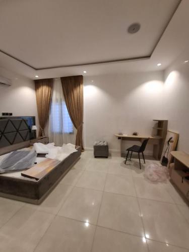Llit o llits en una habitació de Maitama Hotspot