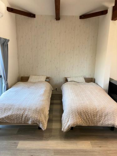 Ένα ή περισσότερα κρεβάτια σε δωμάτιο στο 細島 Base Clutch