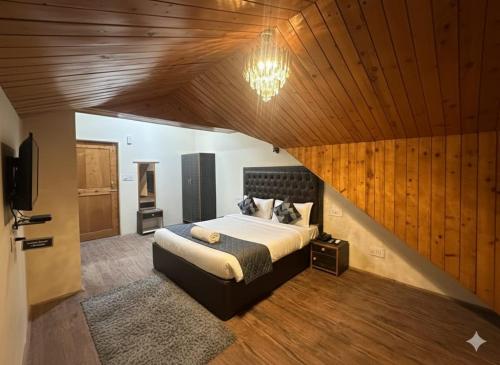 Ένα ή περισσότερα κρεβάτια σε δωμάτιο στο Hotel oscar Mountain Retreat