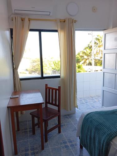 Llit o llits en una habitació de Hostal Insular
