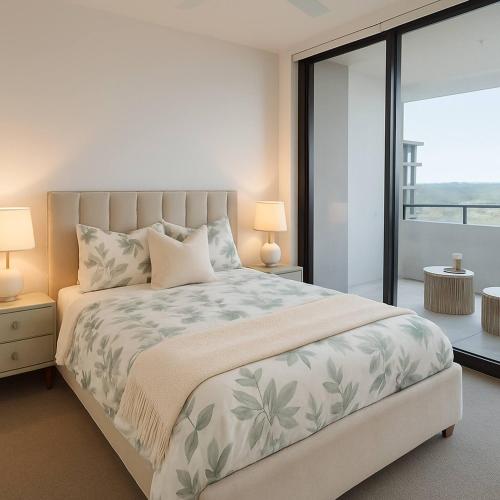 a bedroom with a large bed and a balcony at Milton Oasis level 16- Luxury Apt near Milton Station in Brisbane