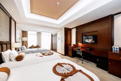 Ένα ή περισσότερα κρεβάτια σε δωμάτιο στο Anji Baihui Hotel