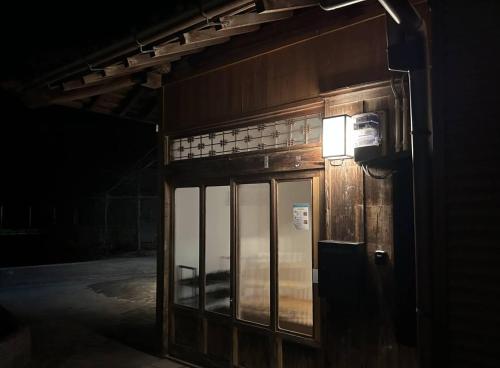 a building with a light on the side of it at SEN HAVEN Sakurai in Shingū