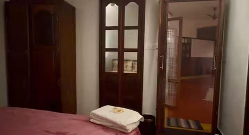 Postel nebo postele na pokoji v ubytování Panackal Heritage Home