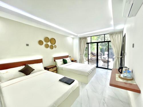 Ένα ή περισσότερα κρεβάτια σε δωμάτιο στο SKY MANSION - Heritage Khmer House
