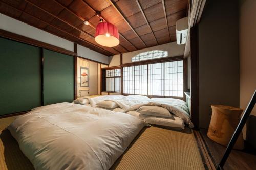 Postel nebo postele na pokoji v ubytování SAKON UKON