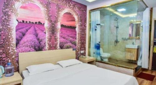 a bedroom with a large bed with a painting on the wall at Super 8 Hotel Jinan Railway Station Square in Jinan
