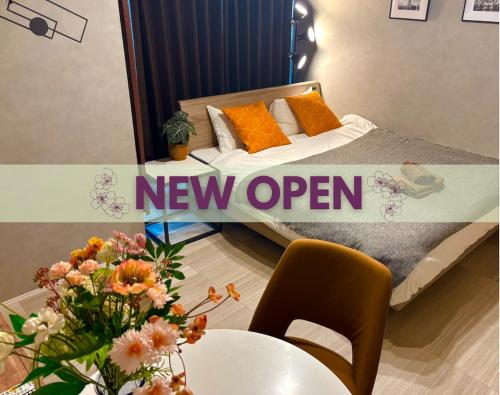 a new open sign on a bed in a room at SALE Flawed Property with a loud music from neighbor but stay cheap in nice area in Tokyo