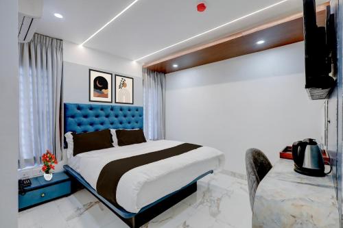 En eller flere senge i et værelse på Townhouse Passport Office Saligramam Formerly K.K Nagar Residency