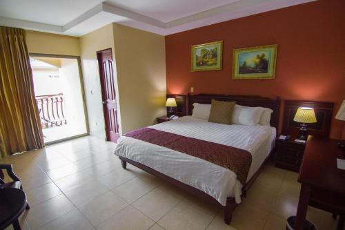 Кровать или кровати в номере Gran Hotel Azuero