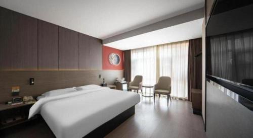 Postel nebo postele na pokoji v ubytování Jinjiang Inn Select Xi'an Hongmiaopo East Daxing Road