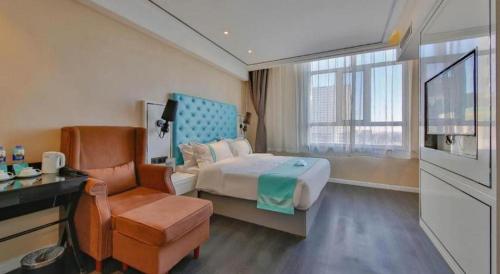 Postel nebo postele na pokoji v ubytování Xana Hotelle Ulanqab Municipal Government Wanda Plaza