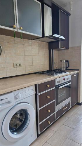 Kuchyň nebo kuchyňský kout v ubytování Cozy flat Centre