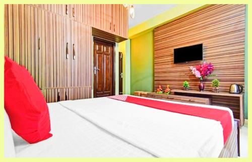 En eller flere senge i et værelse på The Villa Rewa MP