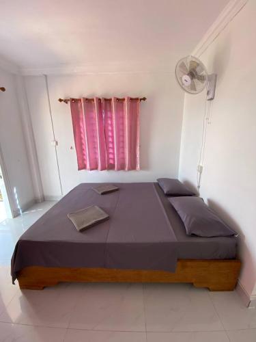 Llit o llits en una habitació de Big Head Bungalows