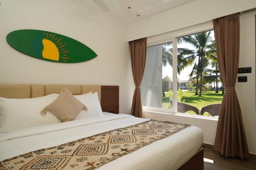 En eller flere senge i et værelse på Trishvam Palolem Beach Resort