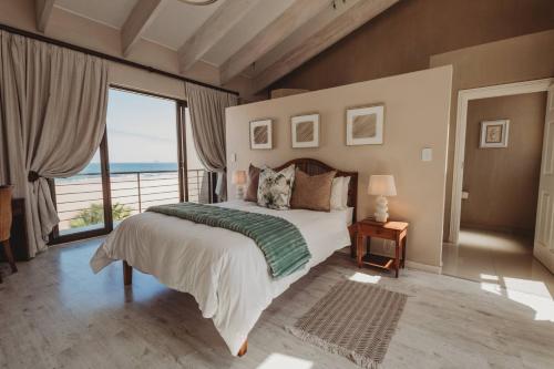 En eller flere senge i et værelse på Klippies - Seafront