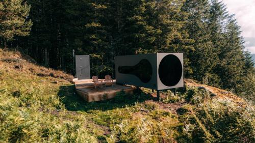 a sign on the side of a hill at Birdbox Bergen in Bergen