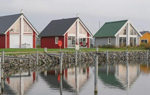 a group of houses next to a body of water at Haus Hafenidyll in Wandlitz