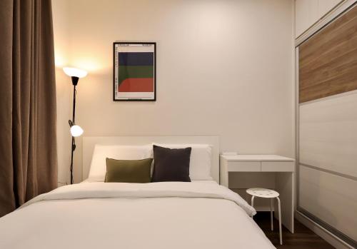 Giường trong phòng chung tại Beullu - Rex Apartment Kuching 6Pax