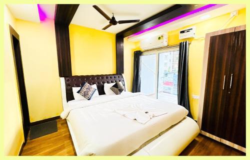 En eller flere senge i et værelse på The Drimea Hapur UP