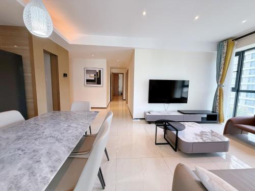 TV a/nebo společenská místnost v ubytování GTC Apartment Hotel