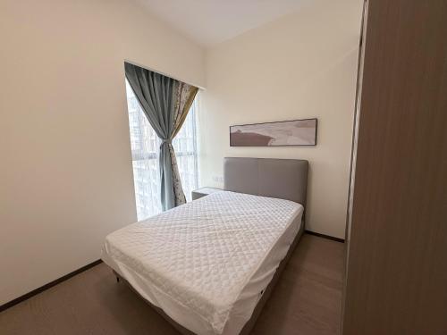 Postel nebo postele na pokoji v ubytování GTC Apartment Hotel