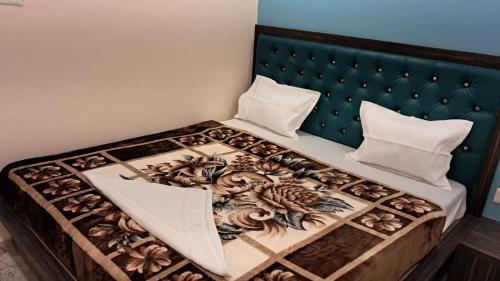 Ένα ή περισσότερα κρεβάτια σε δωμάτιο στο Shree Ram shanti Paying Guest House