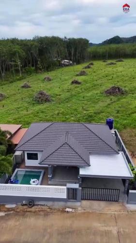 an aerial view of a house with a roof at Aqua pool villa in Ban Nong Thale