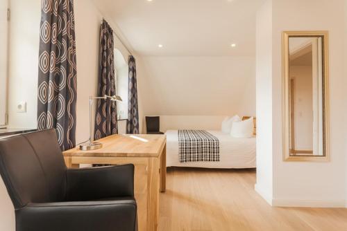 En eller flere senge i et værelse på Haus Hafenflair