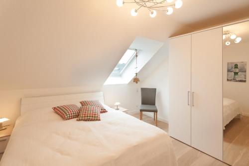 En eller flere senge i et værelse på Haus Meeresrauschen