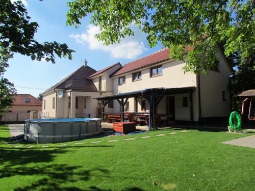 a house with a swimming pool in the yard at Ubytovanie V Súkromí Samuel in Myjava