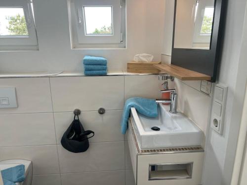 Et badeværelse på Strandhaus Rose Apartement 31