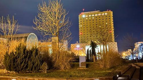 a tall building in a city at night at ANA Crowne Plaza Hotel Kushiro by IHG in Kushiro